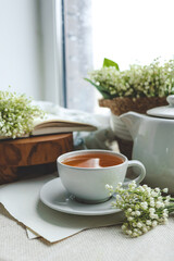 Cup of hot tea and spring home interior. good morning concept