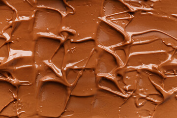 Chocolate background. Melted chocolate. Chocolate swirl.