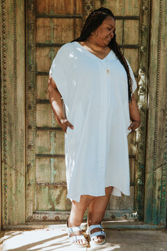 plus size afro latinx haitian american woman smiling outside