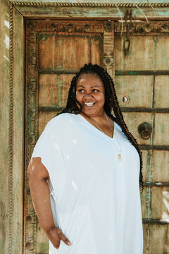 plus size afro latinx haitian american woman smiling outside