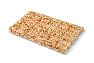 Tasty sunflower seeds kozinaki on white background