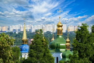 Poster City landscape with ancient Vydubitsky Monastery, river Dnieper and modern high-rise buildings in Kyiv © Artur