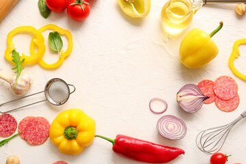 Frame made of ingredients for preparing pizza on white background