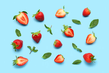 Fresh strawberries on blue background