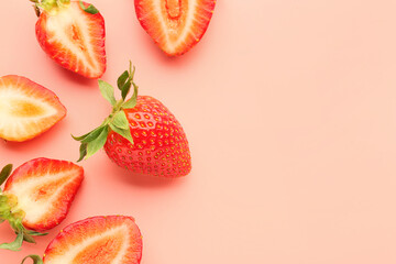 Slices of fresh strawberries on pink background