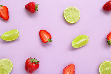 Fresh strawberries with lime on lilac background