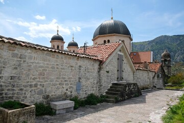 Fototapeta na wymiar Ancient stone church in Kotor, Montenegro. Kotor is a beautiful historic city on the Unesco list. 