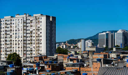 Contrast between buildings and houses in the favela of Rio de Janeiro, Brazil. Common reality in the city. Slum.