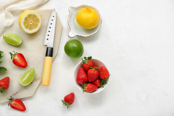Composition with ripe strawberry, lime and lemon on light background