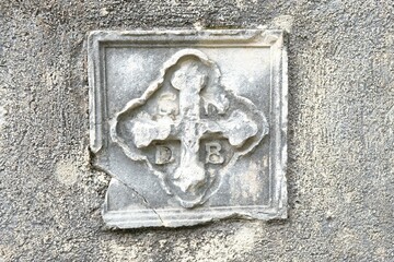 Cross on wall of chapel on fortress wall in Kotor, Montenegro. Kotor is a beautiful historic city on the Unesco list.