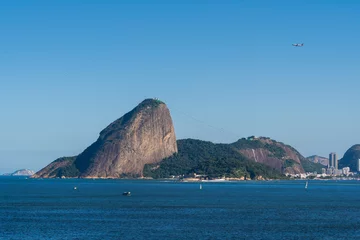  Guanabara Bay in Rio de Janeiro, Brazil with Sugarloaf Mountain in the background. Beautiful landscape and hill with the sea. Sunny summer day © Diego