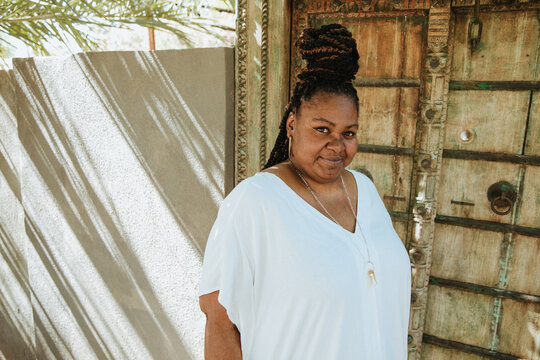 plus size African American woman standing outside a door