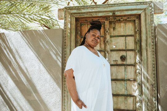 plus size African American woman standing outside a door