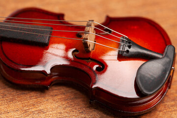 violin in vintage style on wood background