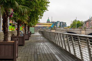 Fototapeta premium O'Connell bridge in Dublin City Centre with yellow bus passing at Dublin Street