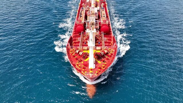 Aerial drone video of small oil chemical tanker cruising near port of Piraeus, Saronic gulf, Attica, Greece