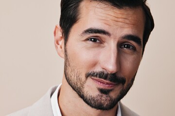 Fototapeta premium man handsome copyspace businessman happy beige portrait suit business arm smiling