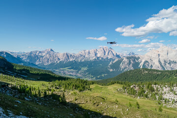 Panorama of the Dolomites in Italy, with a drone in the foreground.