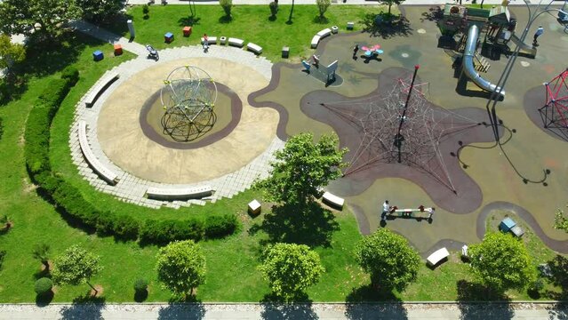 aerial photography of drones in park of Batumi Boulevard Lekha and Maria Kaczynski. This park has many facilities for children, as well as children's playground by sea on sunny day. View city Batumi