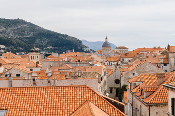 Fototapeta premium Canonical view of the red tiled roofs of the old town of Dubrovnik in Croatia. View from the walls of the old city.