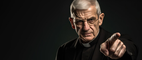 Older priest wagging finger in disapproval