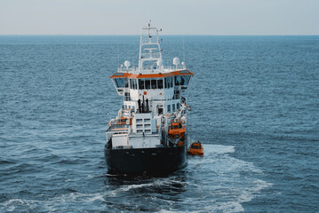 The pilot vessel on duty off the coast of the Netherlands. Search and rescue vessel at sea. Search and rescue operation. Lifeboat drill. Emergency response at sea. © I am from Mykolayiv