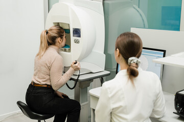 Perimetry eyes test for early sign of glaucoma of woman patient of ophthalmology clinic. Perimetry...