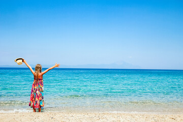 A happy child by the sea in nature weekend travel