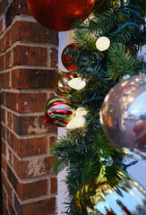 Christmas Holiday decorations on a brick wall in historic and victorian Cape May NJ