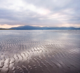 Beach reflections at sunset. County Kerry, Ireland.