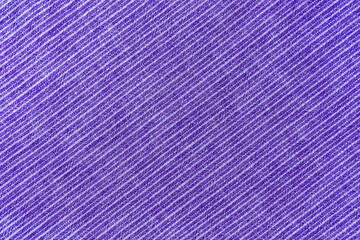 Natural linen texture as background. Cotton fabric with purple and white diagonal line striped pattern, texture close up. Backdrop, wallpaper. Matereal for clothes, curtain and upholstery