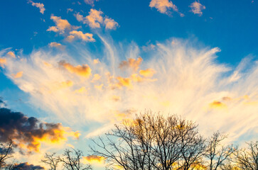 A beautiful, tranquil evening scene of vibrant colors and a dramatic sunset sky