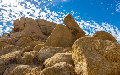 Scattered Clouds Above Split Rock Formation On The Skull Rock Nature Trail, Joshua Tree National Park, California, USA