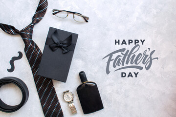 Design concept top view of Father's day gift idea with greeting on wood background.