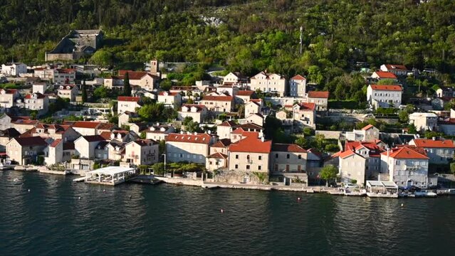 A Timelapse of a cruise ship leaving Kotor Montenegro and old mediterranean port.