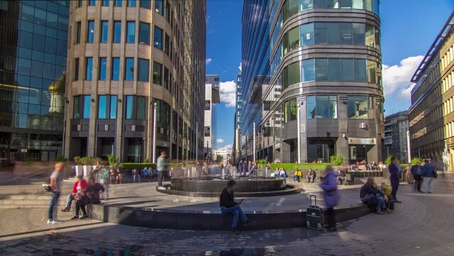 Fountain timelapse hyperlapse on White Square near Office Center located in heart of Moscow, Russia. Sun light reflected in a glass of business skyscrapers at sunny summer day.