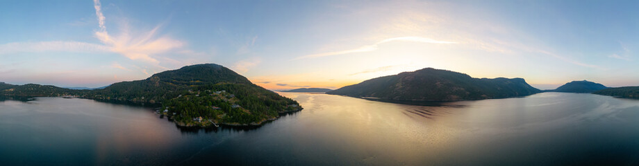 Aerial Panoramic View of Islands on the West Coast of Pacific Ocean. Sunny Sunrise Sky. Maple Bay, Vancouver Island, British Columbia, Canada.