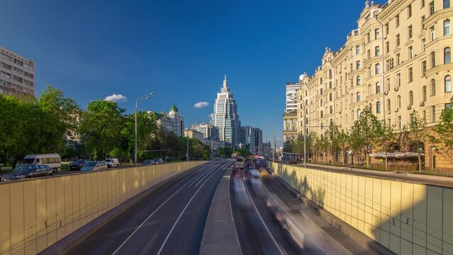 Cars traffic on Garden-Triumph street timelapse hyperlapse in Moscow, Russia. Blue cloudy sky at summer day. Circular avenue goes around central Moscow along old rampart surrounded Zemlyanoy Gorod