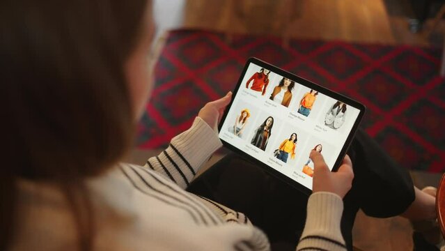 Instant Wardrobe: Woman Buys Clothing on Tablet for Immediate Wear