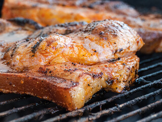 Tasty sizzling woodcutter steaks on the fire grate