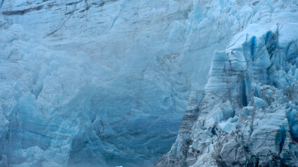 Fototapeta na wymiar Massive blue ice wall of the Surprise Glacier in Prince William Sound near Whittier Alaska