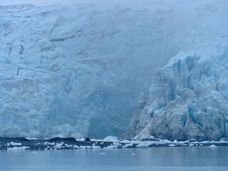 The massive 300 foot ice wall face of the Surprise Glacier on Prince William sound near Whittier Alaska