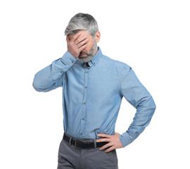Mature businessman covering face with hand on white background