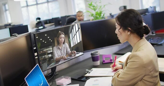 Composition of asian businesswoman using computer and laptop with ai call on screen