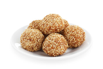 Plate of delicious sesame balls on white background