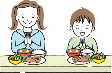 いただきますをするお姉さんと弟
