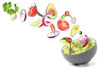 Delicious guacamole with flying ingredients on white background