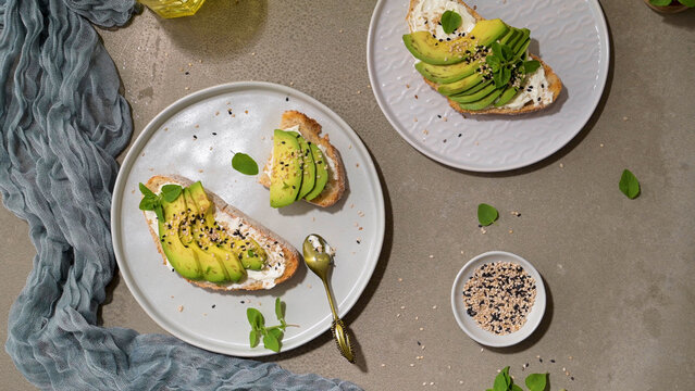 Toast with avocado cream cheese and wheat bread