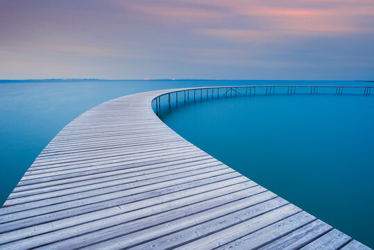 The circle shaped wooden bridge (Infinity Bridge) at dusk, Aarhus, Jutland region, Denmark, Europe