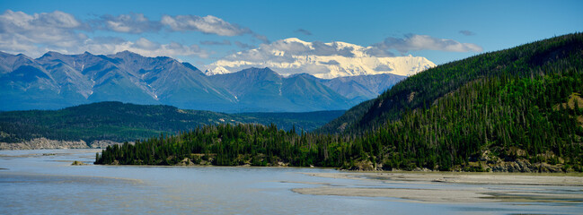 Fototapeta na wymiar Snow covered mountains of the Wrangell-St Elias mountain range as the background to the Copper River near Chitina Alaska